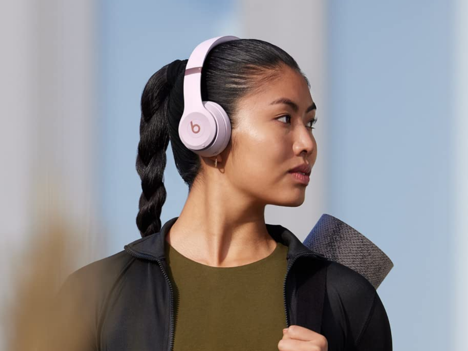 Woman wearing Beats Solo 4 