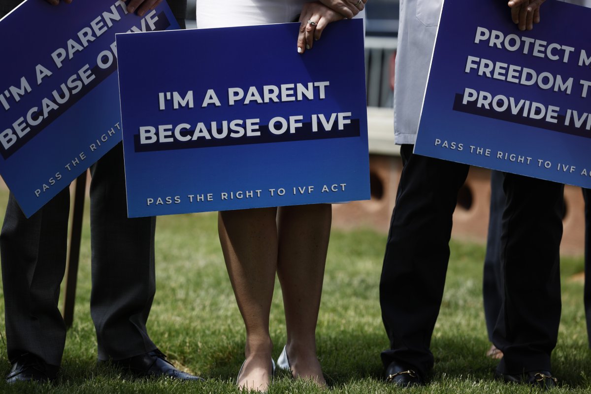  Medical workers and IVF patients listen during 