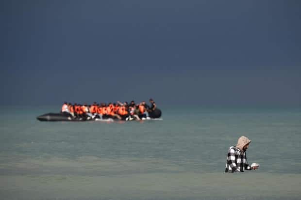 Migrants attempt to cross the English Channel, on the beach of the Slack dunes in Wimereux 