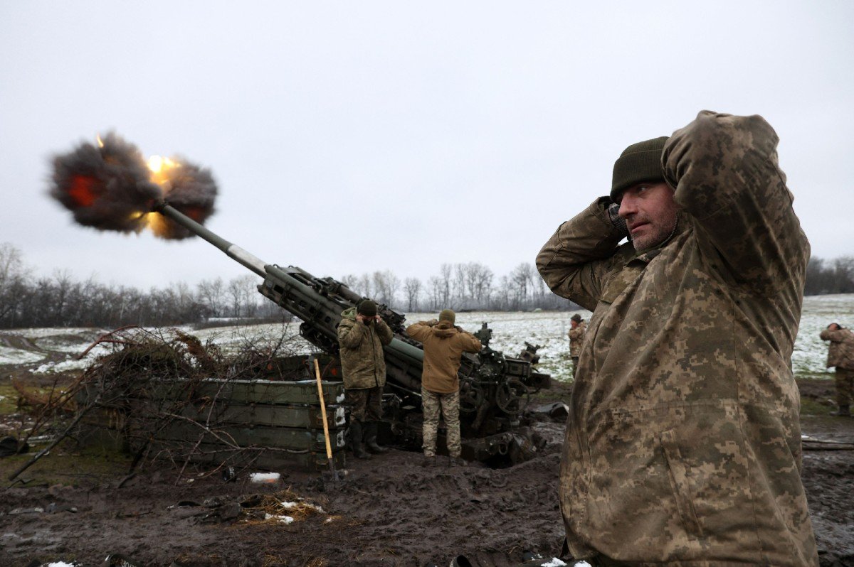 Ukrainian artillerymen fire a M777 howitzer