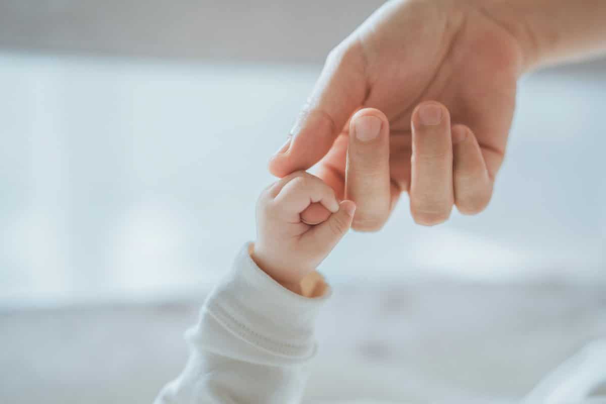 Baby holding hands