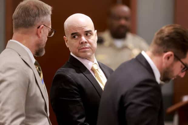 Robert Telles, center, is flanked by his attorneys Robert Draskovich, left, and Michael Horvath during his murder trial at the Regional Justice Center in Las Vegas, Aug. 23, 2024.