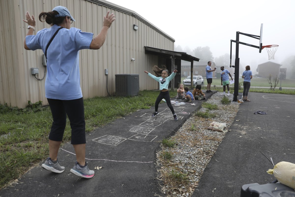 Girl plays hopscotch at Project:Camp in N.C.