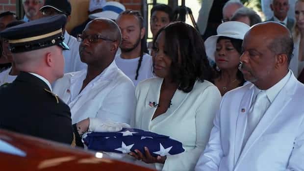 cheryl-wills-receives-flag.jpg 