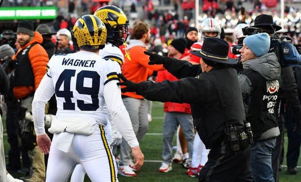 Police use pepper spray when brawl breaks out after Michigan upsets Ohio State