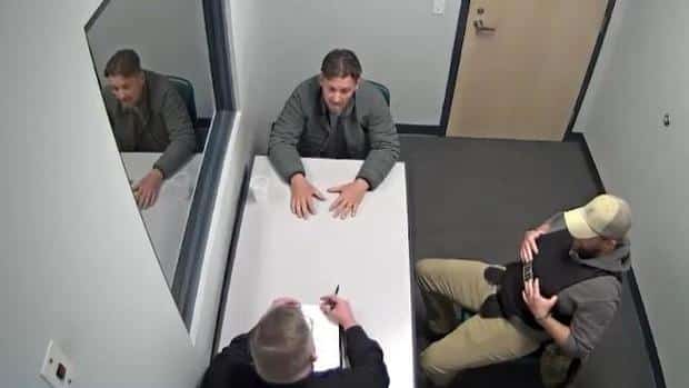 Bobby Tarr talks with detectives.