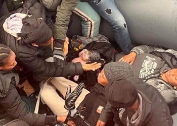 Photo shows rescue of baby girl born at sea on migrant ship