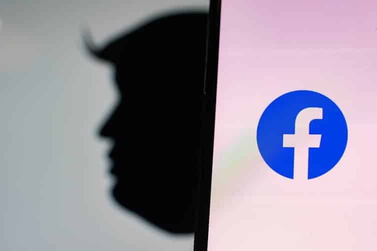 Donald Trump silhouette and Facebook logo on phone