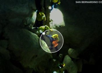 Video shows teen rock climbing is rescued after falling and getting trapped between boulders