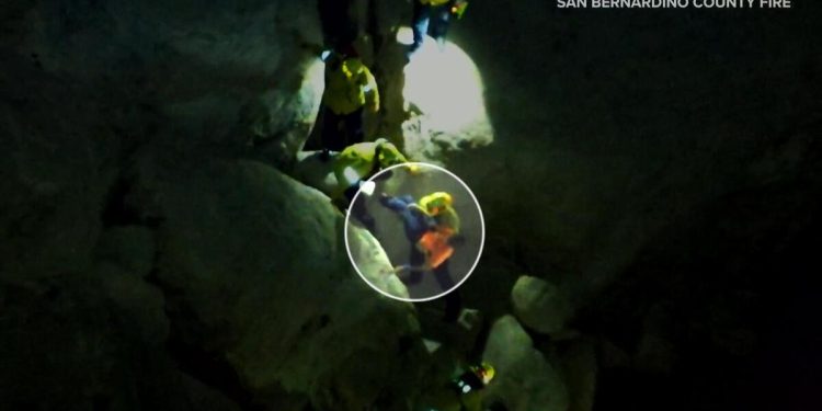 Video shows teen rock climbing is rescued after falling and getting trapped between boulders