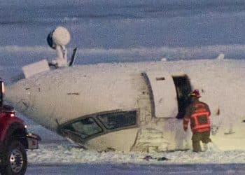 Delta plane crash survivor described hanging upside down after Toronto landing