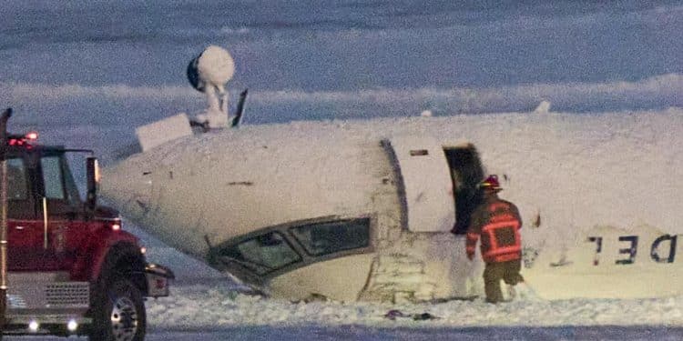 Delta plane crash survivor described hanging upside down after Toronto landing