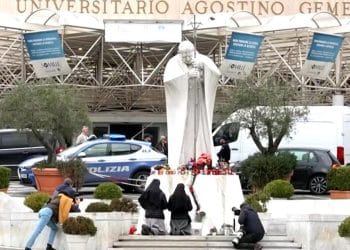 Supporters gather to pray for Pope Francis outside hospital