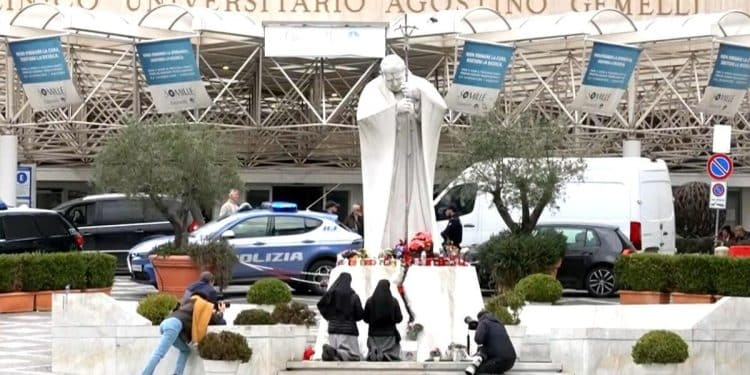 Supporters gather to pray for Pope Francis outside hospital