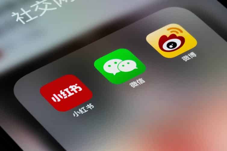 An iPhone screen showing three Chinese social media apps