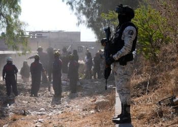 Armed men seen targeting group searching for relatives at cartel site