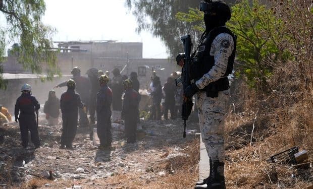 Armed men seen targeting group searching for relatives at cartel site